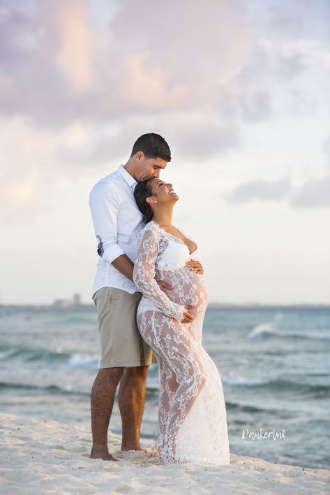 White lace Maternity Dress during a photo shoot on Arashi Beach Aruba White Lace Maternity Shoot, Dresses For Pregnancy Photo Shoot, Pregnant Couple Beach Pictures, Aruba Maternity Shoot, Maturity Photoshoot On Beach, White Beach Maternity Shoot, Babymoon Pictures Couple, Maternity Shoot Poses Beach, Beach Maternity Dresses Photo Shoot