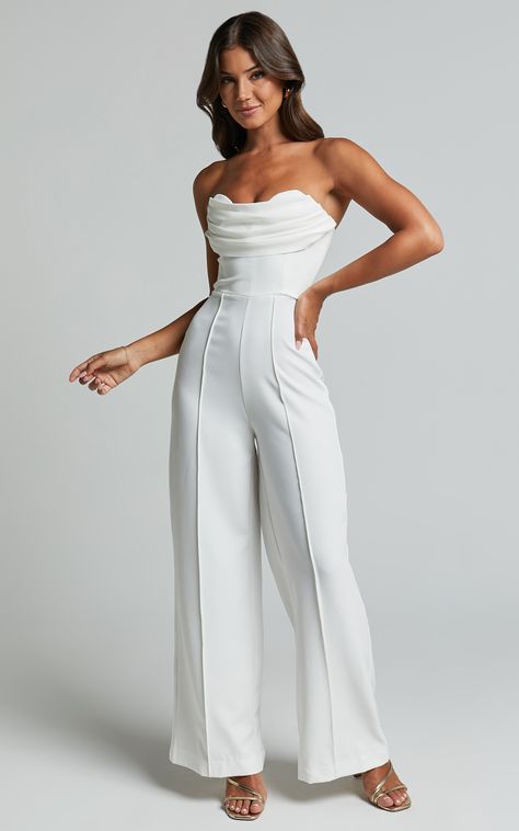 Get ready to turn heads and steal the spotlight in our Stacey Jumpsuit! This strapless cowl wide leg jumpsuit in off white is the perfect choice for any occasion, whether it's a cocktail party or a night out with friends. The sweetheart neckline adds a touch of femininity, while the wide leg design gives you an effortlessly chic look. Made from spandex and polyester, this jumpsuit is not only comfortable to wear but also has just the right amount of stretch to flatter your silhouette. So go ahea Jumpsuit For Graduation For Women, Wide Legged Jumpsuit, Outfit For Going Out With Friends, White Jumpsuit Graduation, Jumpsuit White, All White Outfit Women, Jumpsuit Graduation Outfit, Graduation Jumpsuit Outfit, Graduation Jumpsuit