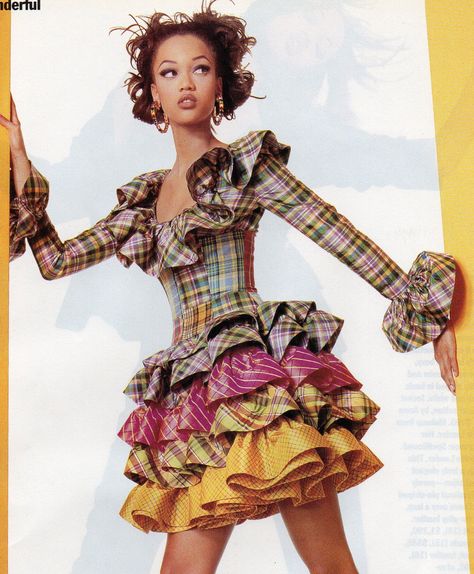 Oscar de la Renta- 1992 Multi-color plaid ruffles skirt and corselet blouse ensemble dress.  Mademoiselle March 1992 Colorful Fashion Runway, Multi Colored Clothes, Vivienne Westwood Plaid Dress, Colorful Runway Fashion, Ruffled Blouse Outfit, Skirts Runway, Runway Poses, Ruffle Blouse Outfit, Runway Skirts