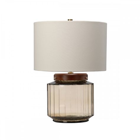 Elstead Lighting LUGA-TL-SMOKE   Elstead Lighting Luga single light table lamp features a distinct smoked glass base with vertical lines topped with dark wood and delicate metalwork, complete with a white polycotton drum shade.   The product code for this table lamp is LUGA-TL-SMOKE.   This environmentally friendly table lamp is manufactured from re-cycled glass which conveys a strong visual effect and combines it with dark wood and fine metal details adding a softness to the contemporary design Stained Table, Brass Wood, Vertical Lines, Table Lamps For Bedroom, Contemporary Living Spaces, Dark Stains, Glass Table Lamp, Diffused Light, Aged Brass