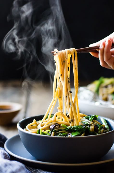 Hot and steamy rice noodles get loads of flavor from ginger, garlic, tamari, toasted sesame oil, and lots of green vegetables in this gluten-free, vegetarian and vegan recipe. This week has been full of excitement. First, I got to test a Mark Bittman recipe and style a shoot for the New York Times. My friend … Continue reading Hot Sesame Rice Noodles with Asparagus, Shiitakes and Pea Shoots Sesame Rice Noodles, Sesame Rice, Bojon Gourmet, Pea Shoots, Plating Ideas, Mapo Tofu, Pasta Bar, Pasta Fatta In Casa, Think Food