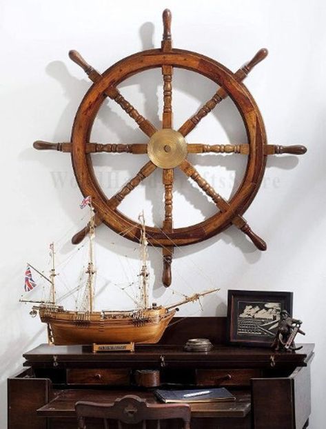 "Beautiful Indian Rosewood Ship Wheel for Home & Office wall Decor, and create memories for a lifetime. Premium Nautical Handcrafted Maritime Wall Decor, Antique Ship's Steering Wheel Replica. Beautiful Antique & Natural Wood Crafts, Premium Smooth Hand Sanded Surface. The aluminum inset enables it to be used as a steering wheel on boats, supported by the Spindles(Handles). Complete Nautical Maritime Wall Decor Hanging, Gift for all Occasions. Sizes Available: - 12\" Length x 12\" Width x 2\" De Ship Wheel Decor, Ship Steering Wheel, Natural Wood Crafts, Wall Decor Antique, Vintage Nautical Decor, Boat Wheel, Pirate Stuff, Captain Gifts, Beach House Wall Decor