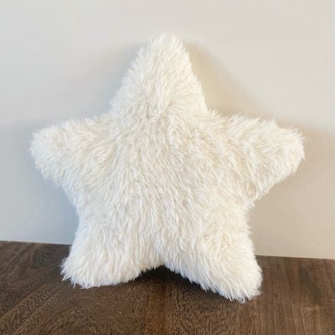 "Introducing our Cozy Star-Shaped Pillow Cushion, a plush and stylish addition to any room. This fluffy star-shaped cushion, crafted with soft faux fur, offers both comfort and a touch of modern decor. Its unique star shape makes it a versatile piece for adding a festive feel during the holidays or as a charming year-round accent. Perfect for snuggling on the couch or as a whimsical touch to a child's bedroom, this pillow is not only a cozy companion but also a delightful decorative item for those who love a minimalist yet playful home aesthetic. Dimensions:   - 14\"x14\" Materials: Gold metallic white faux fur (White star) - 100% polyester Pink Faux fur  -100% polyester" Pillows Aesthetic White, Fluffy Pillows Aesthetic, New Pillows, Aesthetic Cushions, Cute Pillows Aesthetic, Hidy Hole, White Fluffy Pillow, Unique Cushions, Cool Pillows