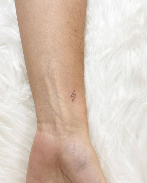 Micro Lightning Bolt Tattoo, Lightning Tatoos Small, Fine Line Tattoo On Finger, Cute Lightning Bolt Tattoo, Small Tattoo Lightning, Lightning Bolt Stick And Poke, Mini Tats Wrist, Small Lightning Bolt Tattoo Finger, Lightning Bolt Wrist Tattoo