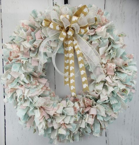 Welcome friends and family into your home this handmade Pastel Easter Wreath. I have hand tied hundreds of Easterinspired printed fabric pieces onto a wired ribbon and added a beautiful wired ribbon bow with Bunny prints on it. Shabby Wreath, Rag Wreaths, Holiday Door Decorations, Easter Mesh Wreaths, Diy Floral Wreath, Whimsical Wreaths, Easter Fabric, Fabric Wreath, Diy Valentines Decorations