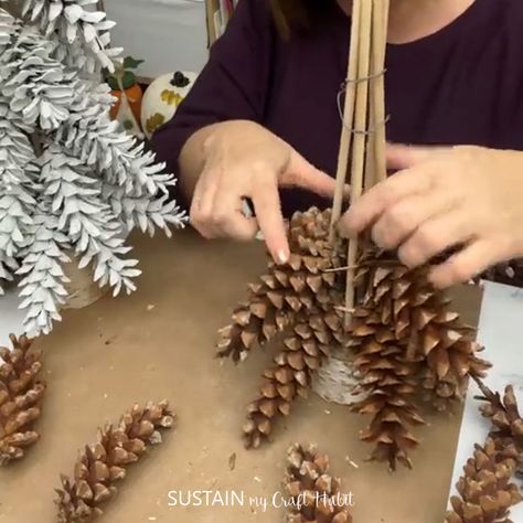 What's better than crafting with nature? Create your own beautiful, natural pinecone tabletop tree using eastern white pinecones and this step by step tutorial. Pinecone Holiday Crafts, Christmas Gift Projects, Pine Cone Projects Ideas, Pinecone Christmas Trees Diy, Pinecones Christmas Tree, Fall Crafts Using Nature, Pine Cone Mobile, Diy Pine Cone Tree, Diy Pine Cone Christmas Tree