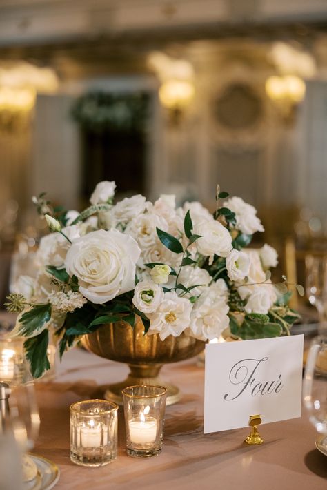 White floral centerpiece in gold compote • Classic and Romantic, Parisian-Inspired wedding at The Blackstone Hotel • Savoir Fête, Chicago Wedding Planner • Photography by Christy Tyler Classic Elegant Wedding Centerpiece, Wedding Cocktail Table Centerpieces, Wedding Table Settings Romantic, Classic Wedding Floral Arrangements, Round Table White Flower Centerpieces, All White Floral Centerpieces, Compote Wedding Centerpieces, Soft Wedding Flowers, Classic Centerpieces Wedding