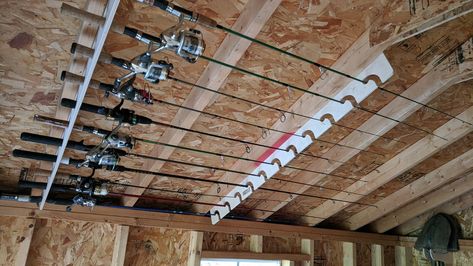 Ceiling Fishing Rod Storage, Garage Fishing Rod Storage, Fishing Rod Holders For Garage, Fishing Rod Storage Garage, Fishing Pole Storage Diy, Hunting Storage Room, Fishing Rod Storage Diy, Hunting Storage Ideas, Hunting Room Storage