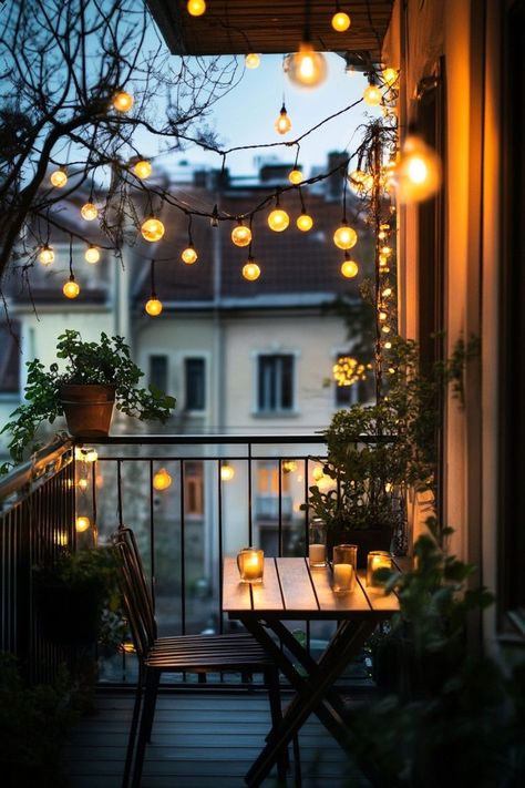 Transform your balcony into a magical oasis with string lights draped around the railings or overhead. Add cozy seating with soft cushions, throw blankets, and a small table for evening relaxation. The twinkling lights will create a warm and inviting ambiance for your outdoor retreat. 🌟🌿 String Lights Outdoor Balcony, Bistro Balcony, Veranda Cafe, Evening Relaxation, Balcony Lighting, House Balcony Design, Home Balcony, Cozy Seating, Outdoor Balcony