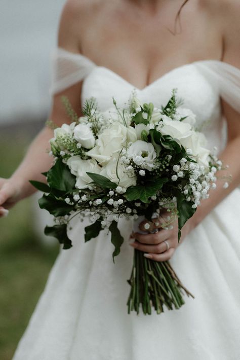 Hand-tied Bridal Bouquet in cool whites and dark green designed by Justine, Oban Florist, The Thistle & The Rose Dark Green Wedding Flowers Bouquets, Dark Green Flowers Wedding, All White And Green Bouquet, White And Green Simple Bouquet, Understated Bridal Bouquet, White And Green Hand Tied Bouquet, Bridal Flowers Bouquet White And Green, Wedding Bouquets White And Green Simple, Cream And Green Bridal Bouquet