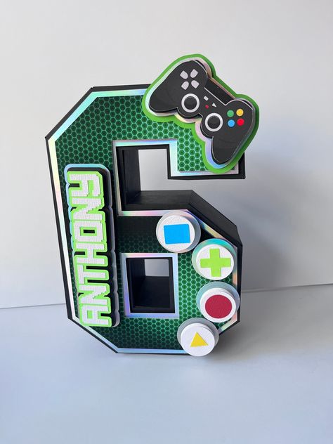 Gamer 3D Letters, Gamer Party Decorations, Gamer Birthday Party, Gamer Room Decor, Video Games Birthday, Gamer theme, Video Games Theme 0001    3D Letters are always a beatiful way to decorate the table at a party and save for keepsake room decor, they simply add a special touch to your spaces.  They can also be created as a unique gift.  Free standing or hanging, these 3D letters give a special and unique touch to your party or room. They are perfect for Gamer Party Decorations, Gamer Room Deco Gaming Birthday Party Centerpieces, Gamer Birthday Party Centerpieces, Gamer Party Snacks, Level 7 Birthday Party, Playstation 5 Party Decorations, Gamer Party Theme, Gaming Theme Party, Nintendo Themed Birthday Party, Gamer Birthday Party Ideas Boys