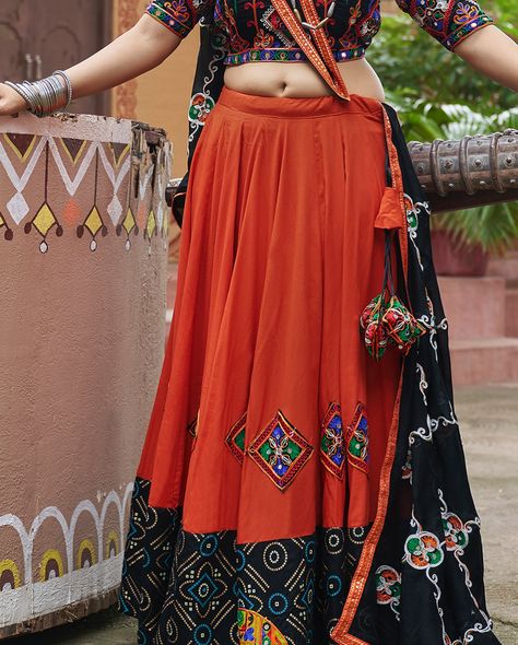 Moderate orange and black navratri lehenga with embroidery and mirror work with viscose rayon dupatta to draped in your style in this navratri festival ✨🧡 SHOP NOW 🛍️ gotifab.com [lehengacholi, navratri lehengas, navratri collection, garba outfits, navratri chaniya choli, lengha choli] #lehengacholi #navratrilehenga #navratricollection #chaniyacholis #garbaoutfits Garba Outfit, Navratri Lehenga, Navratri Collection, Navratri Festival, Navratri Chaniya Choli, Lengha Choli, Festival Shop, Chaniya Choli, Viscose Rayon