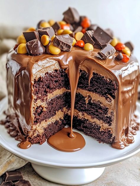 Reese's Peanut Butter & Chocolate Cake Sensation

🍰 𝗜𝗻𝗴𝗿𝗲𝗱𝗶𝗲𝗻𝘁𝘀 🍰 
1 box chocolate cake mix
1 cup water
1/2 cup vegetable oil
3 large eggs
1/2 cup creamy peanut butter
1/4 cup powdered sugar
1 container (16 oz) chocolate frosting
1 cup mini peanut butter cups, chopped
1/2 cup chocolate chips 🍰🍰 Reese Birthday Cake, Reeces Cake Birthday Easy, Reese’s Cake, Reeses Peanut Butter Cake, Reese Cake, Reeces Cake, Reese Peanut Butter Cake, Reese's Cake, Peanut Butter Chocolate Cake