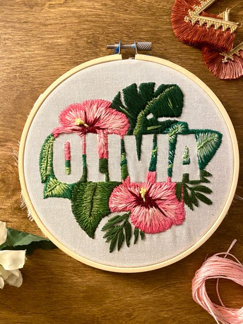 Olivia name negative space embroidery with tropical flowers Negative Space Embroidery Pattern, Negative Space Embroidery Letters, Tropical Embroidery Design, Negative Embroidery, Name Embroidery Ideas Letters, Olivia Embroidery, Name Embroidery Ideas, Embroidery Name Designs, Tshirt Embroidery Ideas