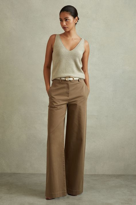 The Eva trousers have a wide-leg finish that fit relaxed through the thighs, starting mid-rise on the hips. Their cotton blend fabric offers technical stretch and a soft cargo feel. Cotton blend. Side pockets. Wide leg. Machine washable. 64% Polyester, 34% Viscose, 2% Elastane. White Wide Leg Pants Outfit Dressy, How To Wear Wide Leg Pants Casual, Womens Trousers Outfits, Spring Essentials Wardrobe, Soft Dramatic Outfit, Black Wide Leg Trousers Outfit, Petite Work Outfits, Trousers Outfit Casual, Wide Leg Trousers Outfit