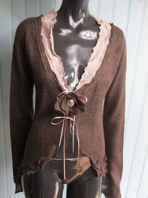 Vintage chocolate brown fine knit mohair cardigan.  This has a hankerchief hem,  pale pink lace on the neckline and a brown rose and pink ribbon to close. Dimensions: Shoulders flat: 18 Inches. Bust: 35 Inches.   Length: 27 Inches. Sleeve: 21 Inches. Size: 12/14 (UK). Made in Italy Knit Cardigan Outfit, Hankerchief Hem, Digital Dress, Knit Lace Dress, Fine Knit Cardigan, Boho Cardigan, Brown Cardigan, Mohair Cardigan, Brown Outfit