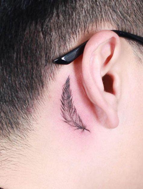 66 Beautiful Bird Tattoos with Meaning - Our Mindful Life Feather Tattoo Men Neck, Birds Behind Ear Tattoo, Bird Tattoo On Neck For Men, Birds Behind Ear Tattoo Men, Back Ear Tattoo Men Guys, Feather Into Birds Tattoo, Crow Feather Tattoo, Back Ear Tattoo, Owl Feather Tattoos