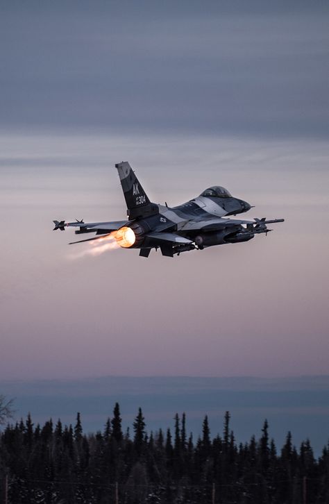 One of 14 U.S. Air Force F-16 Fighting Falcon aircraft with the 18th Aggressor Squadron takes off from Eielson Air Force Base, Alaska, shortly after sunrise Jan. 17, 2015. Air Force Airplane, Air Force Lifestyle, F 16 Wallpaper, Aggressor Squadron, Jet Flying, Air Force Fighter Jets, Photo Avion, Fighter Planes Jets, Air Force Planes