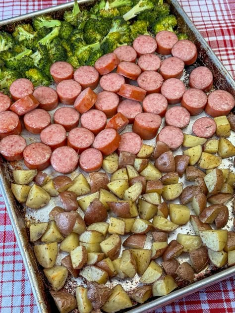 Baking sheet with Kielbasa sausage made in the oven along with roasted potatoes and broccoli on a red and white plaid napkin. Keilbasa Sausage Recipes, Kielbasa And Potatoes Casserole, Cooking Kielbasa, Sausage Casserole Slow Cooker, Roasted Potatoes And Broccoli, Kilbasa Sausage Recipes, How To Cook Kielbasa, Kielbasa And Potatoes, Potatoes And Broccoli