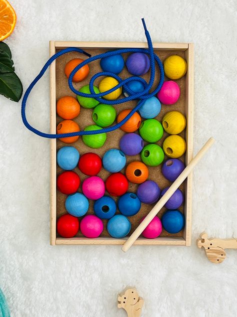 Welcome to our Wooden Lacing Toy Rainbow - where learning meets vibrant playtime! Packed with colorful wooden beads and laces, this toy adds excitement to sorting and aligning tasks, making education a fun adventure. It's a fantastic supporter of Montessori learning, specifically designed to enhance kids' dexterity and color recognition skills. Crafted with precision, our Montessori bead lacing toy fosters hands-on learning experiences, perfect for refining fine motor skills and hand-eye coordin Montessori, Toddler Learning Activities, Rainbow Montessori, Lacing Toy, Montessori Learning, Fun Adventure, Montessori Baby, Color Sorting, Baby And Toddler