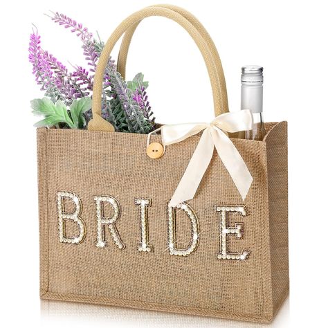 PRICES MAY VARY. Bride Bag Set: you will receive 1 piece of bride beach bag, and 1 piece of ribbon, nice combination for you to use, you can tie the ribbon on the bag, which will make your bag look more charming and delicate Proper Capacity: the plain tote bag measures about 13 x 9.5 x 4.7 inches/ 33 x 24 x 12 cm, proper size for you to store items, such as purses, notebooks, pens, jewelry, cosmetics, and more, please check about the size information before purchase Sturdy and Reusable: our brid Bride To Be Basket Ideas, Bridesmaid Bag Ideas, Bride Basket Gift Ideas, Bachelorette Gifts For The Bride, Bride Gift Basket, Plain Tote Bag, Bridal Gift Ideas, Bride Gift Bags, Bachelorette Party Gift Bag