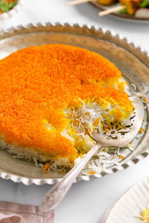 Tahdig is a classic Persian rice dish. With a crispy, golden saffron crust and a mound of fluffy rice, this recipe is more than your average side dish. Persian Crispy Rice, Tahdig Recipe, Rice Crispies Recipe, Saffron Recipes, Persian Rice, Persian Recipes, Fluffy Rice, Boiling Pasta, Lentil Dishes