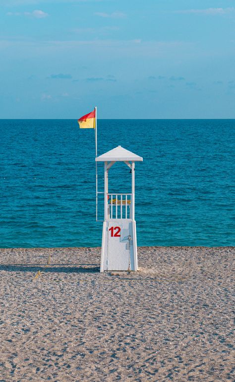 A lifeguard stand on the beach with a flag flying photo – Free Antalya Image on Unsplash Lifeguard Stand, Lifeguard Stands, Lifeguard Chair, Creative Commons Images, Map Marker, A Flag, City Wallpaper, School Photos, Book Images