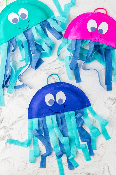 Ocean Art Projects For Kids Toddlers, Rainbow Fish Paper Plate Craft, Paper Plate Mermaid Craft, Easy May Crafts For Kids, Toddler Spring Crafts Easy, Paper Plate Jelly Fish Craft, Paper Plate Spring Crafts, Star Fish Craft For Toddlers, Jellyfish Paper Plate