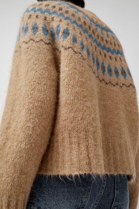 Wool blend pullover sweater with updated fair isle detailing. Slightly cropped and boxy. Chunky ribbed crew neckline, hem, and cuff. Pink Fair Isle Sweater, Nordic Sweaters, Fair Isle Vest, Fair Isle Pullover, 2024 Moodboard, Icelandic Sweaters, Nordic Sweater, Blue Knit Sweater, Wedding 2025