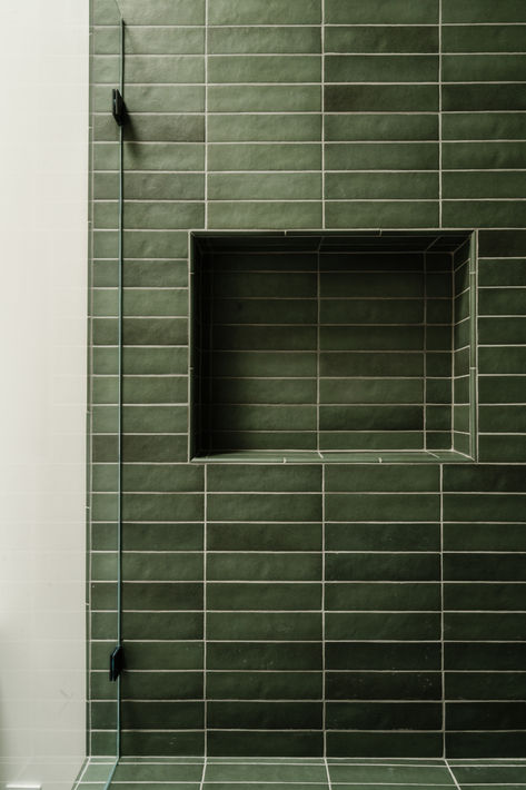 Horizontal stacked green tile in shower of this moody bathroom for a teenage boy, a style that will transition throughout the years. #thedendesigngroup #showertile #moodyshower #moodybathroom #greentile #horizontallystackedtile #bayareainteriordesign Bathroom Horizontal Tile, Green Tile Shower Niche, Green Shower Niche, Green Tile Bathroom With Tub, Horizontal Tile Shower Ideas, Green Bathroom Tiles Wall, Green Tile Black Grout, Horizontal Stacked Tile, Dark Green Shower Tile