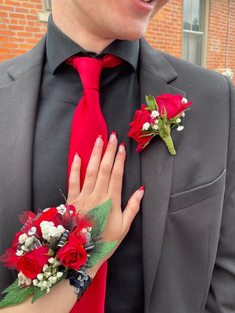 Red Tux Prom, Prom Corsage Red, Red Prom Suit, Red Corsages, Prom Outfits For Guys, Black Corsage, Prom Flowers Corsage, Prom Planning, Prom Corsage And Boutonniere