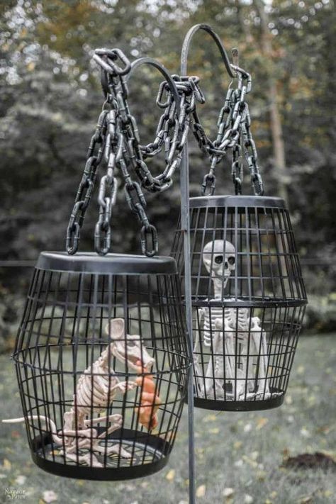 Using Dollar Tree Laundry Baskets and Dollar Tree Skeletons, make this Hanging Cage Halloween prop. On a budget, looking for inexpensive Halloween Decor? Look no more. We have some of the the best Dollar Tree Halloween Crafts and DIY Halloween Home Decor Ideas. Make your house look great for the cost of a dollar! #dollartree #dollartreeideas #dollartreedecor #dollarstore #dollarstoreideas #halloween #halloweendecor #dollartreefalldecor #dollartreehalloween #dollarstorehalloween Fun Diy Halloween Decorations, Dollar Store Halloween Decorations, Dekorasi Halloween, Halloween Diy Outdoor, Easy Diy Halloween Decorations, Dollar Tree Halloween, Halloween Props Diy, Casa Halloween, Dollar Store Halloween