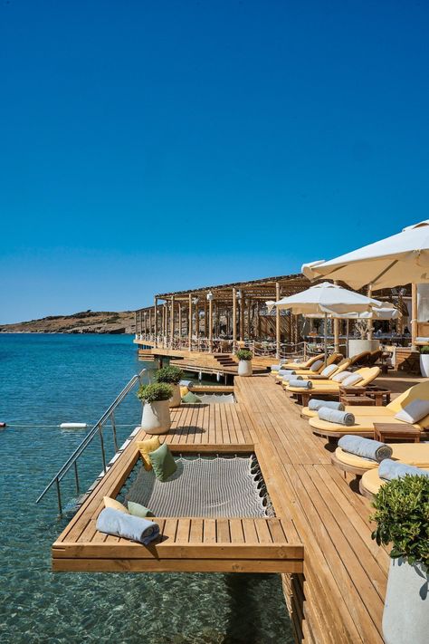 A chic beach getaway destination tucked away in a cove with views of Bodrum’s old town. The multi-room villas are perfect for groups of friends. The open-air deck at Folie Beach restaurant is a popular spot for soaking up the sun, too, and the over-water hammocks add an extra touch of luxury. #turkeyluxuryhotel #luxuryhotelsturkey #bodrumturkeyhotelluxury #bodrumhotelluxury #bodrumturkeybeach #bestresortsinbodrum #bestplacestostayinbodrum #turkeyluxurybeachresort Alanya, Restaurant With Sea View, Beach Hotel Design, Luxury Vacation Spots, Bodrum Beach, Beach Dock, Luxury Beach Vacation, Hotels In Turkey, Hotel Beach