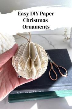 Make your own paper ornaments for easy and affordable DIY Christmas decorations! I have several styles that you can make. DIY Christmas ornaments with book pages or other paper types are so inexpensive and you can enjoy them for years!  Paper Types To Use  • book pages  • cardstock  • construction paper  visit Hootshack.com to learn more! Paper Ornaments Diy, Make Your Own Paper, Paper Ball, Book Christmas Tree, Easy Christmas Ornaments, Paper Christmas Ornaments, Paper Christmas Decorations, Christmas Crafts For Adults, Book Page Crafts