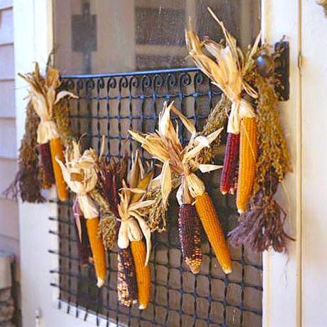 Cornhusk Garland | Bring the warm colors of fall into your home with these beautiful and simple decorating projects. There are so many ways to decorate your home in a tasteful and festive way for fall. Pumpkins, gourds, fall foliage, and pinecones are a handful of popular themes that can serve as inspiration. You can mix all of these elements together across your mantle or you can stagger them artfully down your front steps. You can make a fall wreath out of miniature pumpkins. Use all cream for Side Gardens, Thanksgiving Tables, Broom Corn, Corn Stalks, Deco Champetre, Fall Decorating Ideas, Side Yards, Indian Corn, Fall Deco