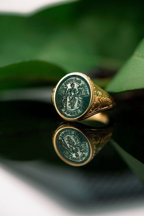 A bloodstone signet ring that can be carved with your own custom design. *real images of the ring, taken by us* Bloodstone Size: 15x13mm Material: - Sterling Silver (925) - 9K Gold (375) - 14K Gold (585) - 18K Gold (750) *All signet rings are hallmarked on the back for certification* - We offer FREE Worldwide DHL & FedEx Shipping! - Branded DanelianJewelry Gift Box with each order! Our customer service is available 7 days a week. Leave us your message, and we will get back to you within a little Man Silver Ring, Mens Signet Rings, Family Crest Ring, Royal Ring, Family Crest Rings, Bloodstone Ring, Custom Signet Ring, Inexpensive Jewelry, Men Coat