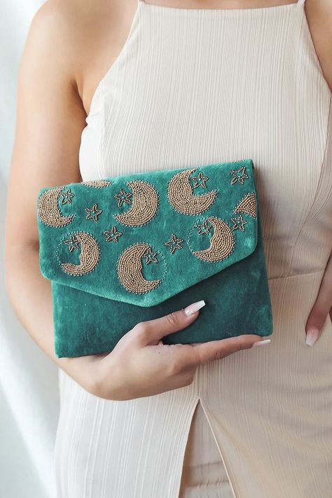 Across the Stars Teal Velvet Beaded Clutch! Low pile velvet is embellished with gold and gunmetal beading that creates a celestial pattern. Lift the top flap to reveal a magnetic closure and a lined interior with a singular sidewall pocket. Attached antiqued bronze chain strap. #velvet #beaded #clutch Fancy Clutch Purse, Handmade Fabric Purses, Whimsical Wardrobe, Celestial Pattern, Teal Purse, Canvas Bag Design, Beaded Pouch, Handmade Fabric Bags, Teal Velvet