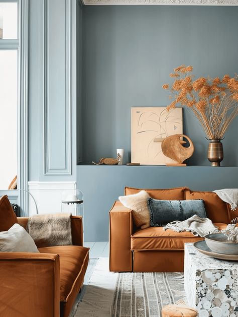 What Colors Go With A Rust Color Scheme In Your Home? [17 Color Ideas You Will Love!] Rust Furniture Living Room, Rust Complementary Colors, Light Blue And Terracotta Living Room, Analogous Color Scheme Interior Design, Beige And Terracotta Living Room, Rust And Cream Living Room, Living Room With White Floor, Blue And Orange Living Room Color Scheme, Bright Interior Paint Colors