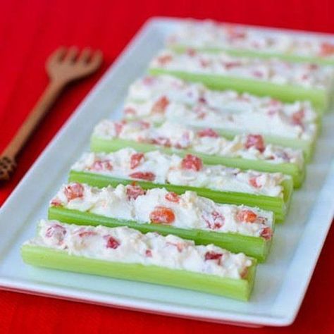 10 Recipes That Defined the 1960s — Recipes of the Decades  Stuffed Celery and Cherry Tomatoes #sixties #60s #60sparty Essen, 60s Food, Celery Recipe, Stuffed Celery, 1960s Food, Cocktail Party Appetizers, Finger Food Recipes, Celery Recipes, Fluff Desserts