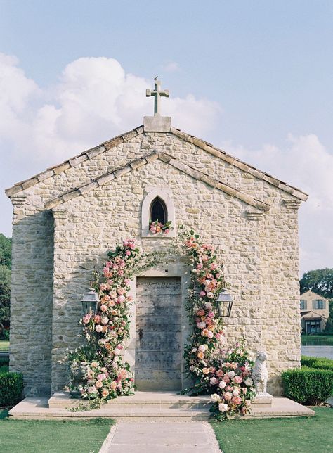 The French Chapel with a flower arch for a wedding at The Clubs at Houston Oaks. Head to the blog to get more flower inspiration from this wedding! Wedding Chapel Flowers, Chapel Wedding Florals, Stone Chapel Wedding, Chapel Wedding Decorations, Wedding Gate Decoration Floral Arch, Wedding Church Flowers, Wedding Ceremony Floral Arch, Anthonys Chapel Wedding, Outdoor Cocktail Hour