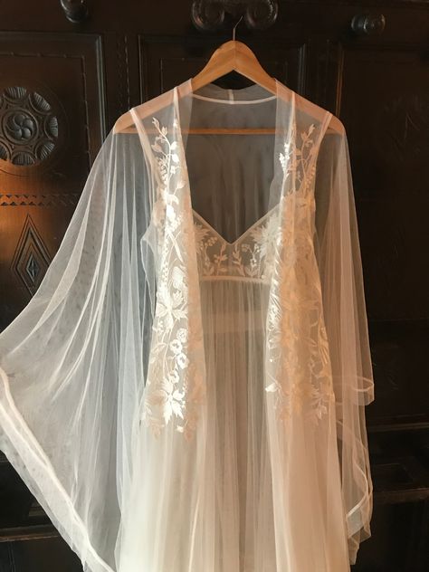 Magnificent see-through robe with long wide draped sleeves embroidered with lace. There is no better choice for a wedding night or honeymoon. The look is completed with the long matching nightgown. #sheerrobe #seethroughlibgerie #longbridalrobe #boudoirphoto #romanticlingerie #nightwear #weddinglingerie #sleepwear #lacelingerie #weddinggowns #bridaldresses #bridallingerie #bridalshowergifts #bridalrobes #blacklingerie #роскошноебелье Lingerielook Outfit Wedding Night, Kimonos, Nightgowns For Women Honeymoon, Nighty Night Dress For First Night, Wedding Linger Honeymoon, Organza Nightgown, Bride Nightwear, Wedding Lingerie Outfit Night, Night Gown Transparent