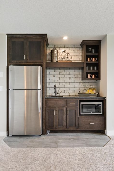 Wet Bar Ideas Full Fridge, Finished Basement Ideas With Kitchen, Small Kitchen Ideas For Basement, Very Small Family Room Ideas, Small Basement Bar Ideas Rustic, Makeup Counter Ideas, Wet Bar Kitchenette, Knotty Alder Cabinets With Brick Backsplash, Wet Bar Ideas With Refrigerator