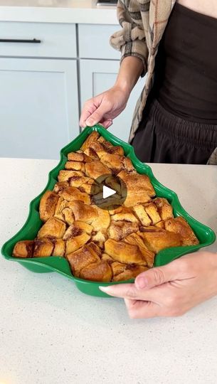 Easy holiday breakfast | breakfast, cinnamon roll, Rick Lax, casserole | Easy holiday breakfast

Woman makes a cinnamon roll casserole in the shape of a christmas tree.

This original video was produced by Network Media, Rick... | By Life with Coco | Okay. These are just our
cinnamon roll grams. Mm. Lots of grams. Open up one more
package so we can really fill up our Christmas tent. Save the icing for later. Quickly just cut these into
your fourths. So two quick cuts. Fill up your pan. You can
do this in a regular pan if you don't have a Christmas tree pan
but I wanted a festive Christmas breakfast. I love
that. It's definitely one of those little touches that kind
of makes a difference. Yeah right? It makes it fun for any
party or if you have like a slumber party or something like
that wi Cinnamon Roll Tree Breakfast, Cinnamon Roll Christmas Tree Breakfast, Cinnamon Rolls Christmas Tree, Breakfast Cinnamon Roll Casserole, Classroom Christmas Party Food, Christmas Tree Breakfast, Cinnamon Roll Christmas Tree, Christmas Tent, Cinnamon Rolls Christmas