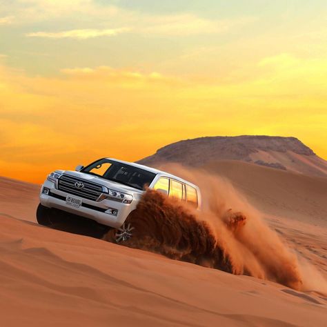 Begin your Dubai desert safari with a prompt pick up from your accommodation in a 4WD vehicle. After the 40-minute drive to reach the Red Dunes for a safari, you can take a quad bike ride if you are looking for more adventure. Enjoy the Dune Bashing activity and try sandboarding with a photo secession. Later, move on to the Bedouin camp where Arabian Qahwa, Luqaimat, dates, and soft drinks will be served as a sign of welcome. You can wear traditional Arabian attire and pose for more photographs. Safari Jeep, Dubai Tourism, Desert Safari Dubai, Bbq Dinner, Dubai Tour, Adventure Tourism, Sand Surfing, Dubai Desert, Fun Deserts