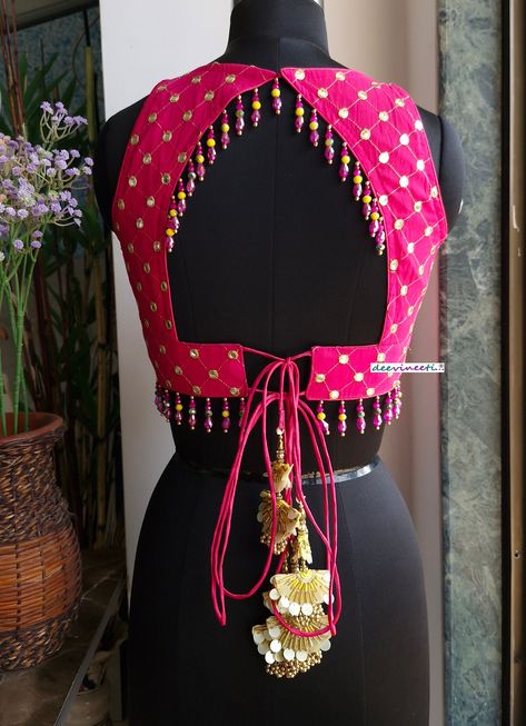 This Made to Order/Made to Measurement/Custom Made Indian Ethnic Blouse. - Fabric - Embroidered Georgette - Color - Hot Pink - Padded - Princess Cut - V Neck - Lined - Back String Closure with tassels - Backless with beads embellishment - Beads around the waist - Extra margin and extra stitches included in the blouse PLEASE NOTE: BUYERS ARE RESPONSIBLE FOR ANY CUSTOMS AND IMPORT TAXES THAT MAY APPLY. This is a made to order product. If you opt for 'Made To Measurement Option', we will provide a measurement template and you can share the measurements likewise. If you want to opt for 'Standard Size', Please refer to the size chart provided in the listing. Shipping: Standard Shipping is done by DHL ecommerce and it mostly takes 2 to 3 weeks to deliver after dispatch. Express Shipping is done 2 Colour Blouse Designs, Sleeveless Blouse Designs For Lehenga Back, New Blouse Back Designs, Blouse Back Model, Backless Blouse Pattern, Blouse With Tassels, Back Neck Models For Blouses, Blouse Tassels, Back Neck Blouse Design