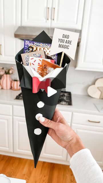 Mimi Markopoulos on Instagram: "🖤Father’s Day DIY - Paper Tuxedo Cone🤍 .  Stumbled upon this adorable DIY project by the talented creator @bellarteskids on TT and instantly felt inspired to give it a go, especially since I had all the necessary materials on hand! This simple yet charming DIY idea is ideal for crafting the perfect Father’s Day gift vessel.  The lovely Father’s Day print I used is from @oliveandeveco! Their collection of printables for various holidays is simply amazing, and at just $5, O&E offers fantastic options to elevate your gifts and decor. 😍 . More Father’s Day DIY ideas coming up 🤍🤍 . . . . . . #fathersday #fathersdaydiy #fathersdaygift #craftymom #girl@im #mdblogger #mdgirlmom #makeitwithmichaels #cardstockcrafts #cardstock" Father Day Decoration Ideas, Fathersday Gift Diy, Fathers Day Activities For Kids, Fathers Day Gifts Ideas From Kids Diy, Father's Day Decorations Ideas, Fathers Day Decoration Ideas, Diy Father's Day Gifts Easy, Fathersday Gift Ideas, Fathers Day Activities