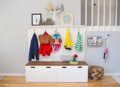 The secret to an organized home is never believing you have enough storage. Here, two storage benches serve an even greater purpose with the addition coat and bag hooks and a ledge shelf up top for adorable art. Get the tutorial at The Mombot » Ikea Entryway, Ikea Stuva, Ikea Organization, Hacks Ikea, Diy Mudroom Bench, Mud Room Storage, Ikea Ideas, Ikea Hackers, Diy Ikea Hacks