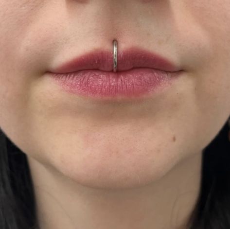 SLITHERING BY WITH THIS MEDUSA PIERCING 🐍  PIERCED BY @alexpokes   Soho, Union Square, and Williamsburg  11AM-9PM 7 DAYS A/W🕘 WALK-INZ OR BOOK ONLINE..📕 TATTOOS & PIERCINGS, NO ATTITUDE, NO MISERABLE HOOPS TO JUMP THROUGH....🚫 WALK-INZ WELCOME OR BOOK ONLINE AT ⚔️livebytheswordtattoo.com⚔️ . . . . #livebythesword #medusa #medusapiercing #lipring #lippiercing Medusa Piercing Hoop, Medusa Piercing Ring, Medusa Ring Piercing, Medusa Piercing Aesthetic, 3 Lobe Piercings, Medusa Piercing Jewelry, Stretched Septum, Medusa Piercing, Pin Up Tattoos