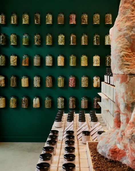 Rammed-earth counter anchors Flamingo Estate pop-up in Los Angeles Nuts Store Interior Design, Flamingo Estate Branding, Scaffolding Architecture, Nut Store, Big Jars, Green Moodboard, Apothecary Design, Flamingo Estate, Moroccan Aesthetic