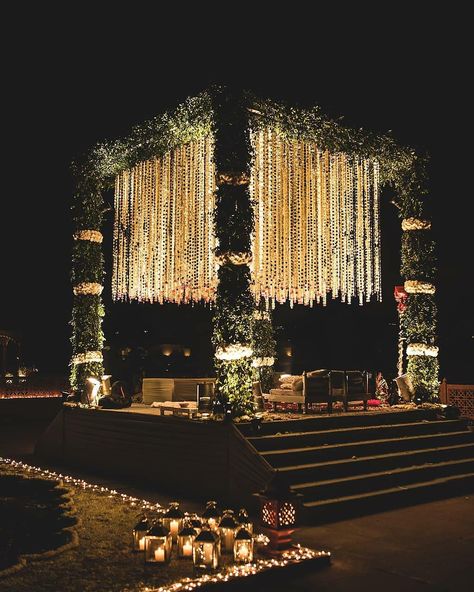 This gardenia mandap is oomphing out major decor goals . . Decor @auraaffaire Originally Featured on @weddecor.in . . . Follow us for more decor inspiration for your dream wedding.First premium page for all your decor fantasies. Tag us @weddecor.in to get featured. Email your original work at weddecorindia@gmail.com #weddecor #mandapdecor #intimatemehndi #intimateweddings #haldidecor #mehndidecor #fun #calmingdecor #beautifuldecor #weddinginspiration #weddingdecor #indianweddings #weddin Wedding Mandap Decoration Night, Luxury Wedding Decor Indian, South Indian Night Wedding, Indian Wedding Decor Aesthetic, Marriage Mandap Decoration Indian Night, Mandap Design Night, Mandap Designs Outdoor Night, Marriage Chori Design For Night, Mandap Decor Indian Outdoor Night